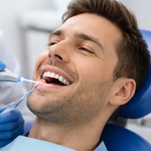 Post-periodontal surgery recovery care and gentle dental treatment at Dental Care Khagaria